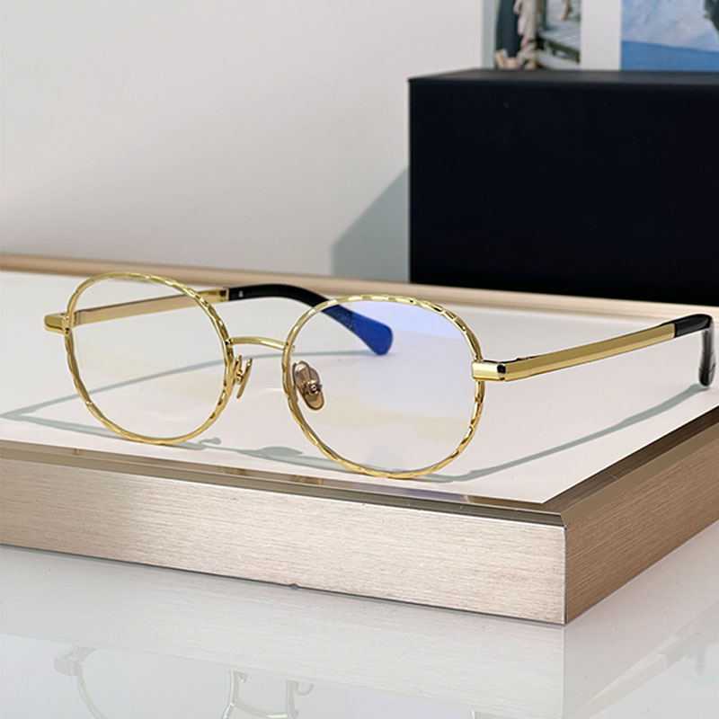 Oval shaped womens designer Sunglasses metal gold frame and transparent lenses designed in the style of intellectuals by the College of Design UVA10