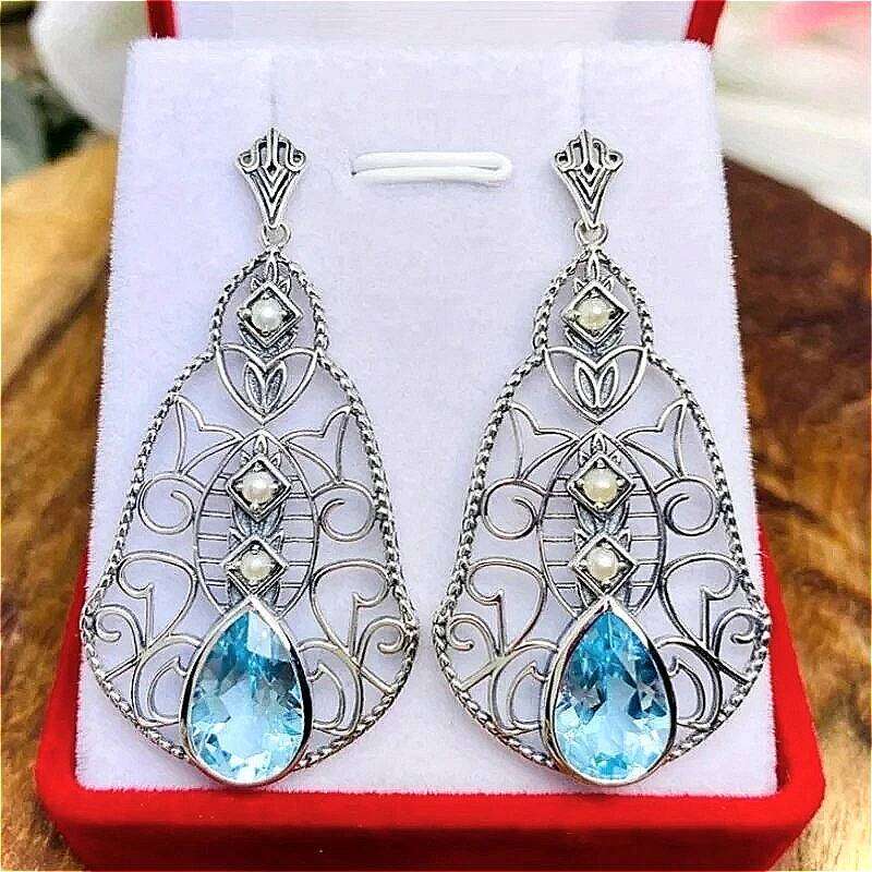 Pendientes colgantes de circonita sintética azul con incrustaciones huecas talladas a mano de estilo bohemio Vintage para mujer, preciosa joyería de
