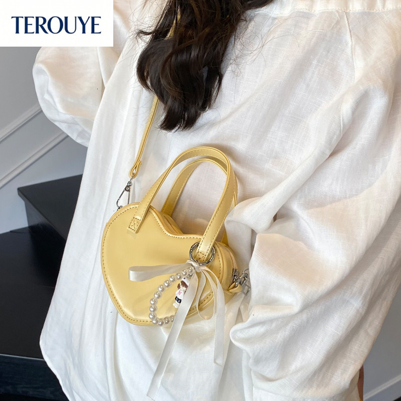 terouye top fashion new item niche design simple and atmospheric trend heartshaped handbag small solid color womens shoulder bag luxury bag