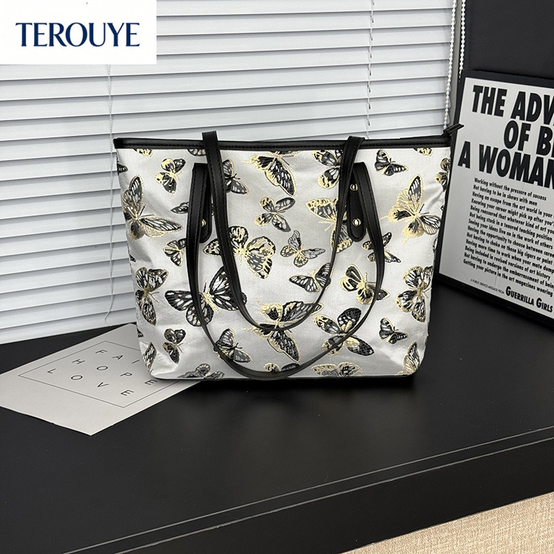TEROUYE autumn new large capacity handbag atmosphere niche style fashionable and simple commuting butterfly print shoulder bag women s shoulder bag