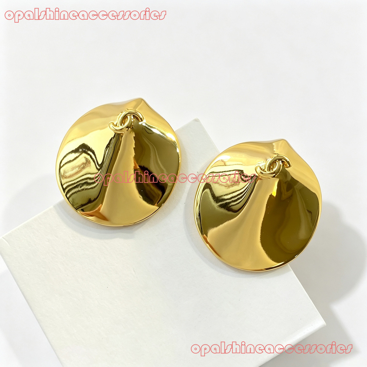 Designer Jewelry Channel 26 gold Shell earrings with fashionable design and a light vibe CC Earring
