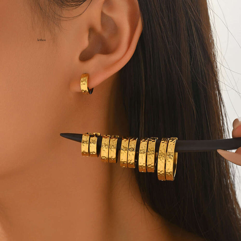 Korean-style fashionable 925 Sterling Silver 18K Gold earrings with a crushed ice texture Great Wall pattern unique design suitable for both men and