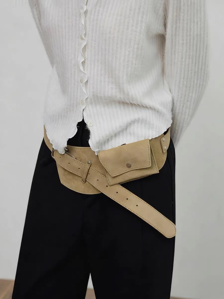 The designer-made exquisite wide leather belt with a lace closure and artificial suede decoration is perfect for both casual and formal outfits.