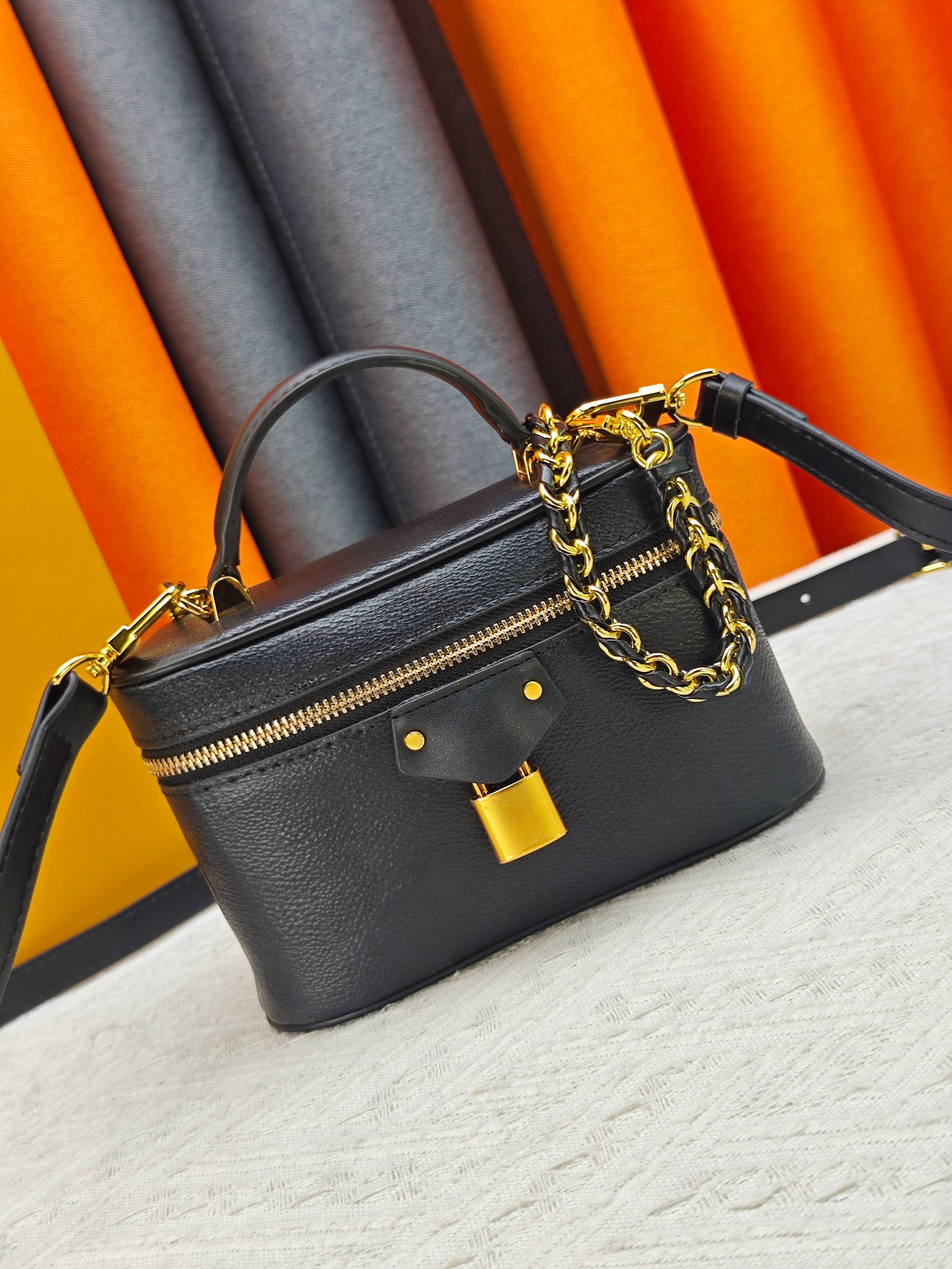 Classic letter interweaving printed embossed pattern makeup box with woven chain top handle for single shoulder and handheld makeup bag