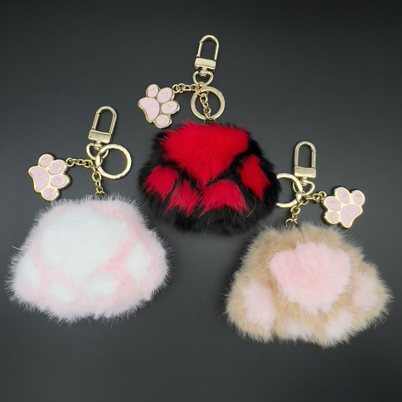 Designers patte de chien charmes boule de fourrure Poms pour femmes luxe pompon porte-clés accessoires sac décoration femme or porte-clés chaud