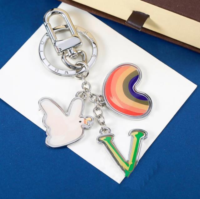 Designer Silver Tone Metal Brand Keychains With Rainbow Heart Dove And Letter Charms Playful Daily Bag Accessory Gift