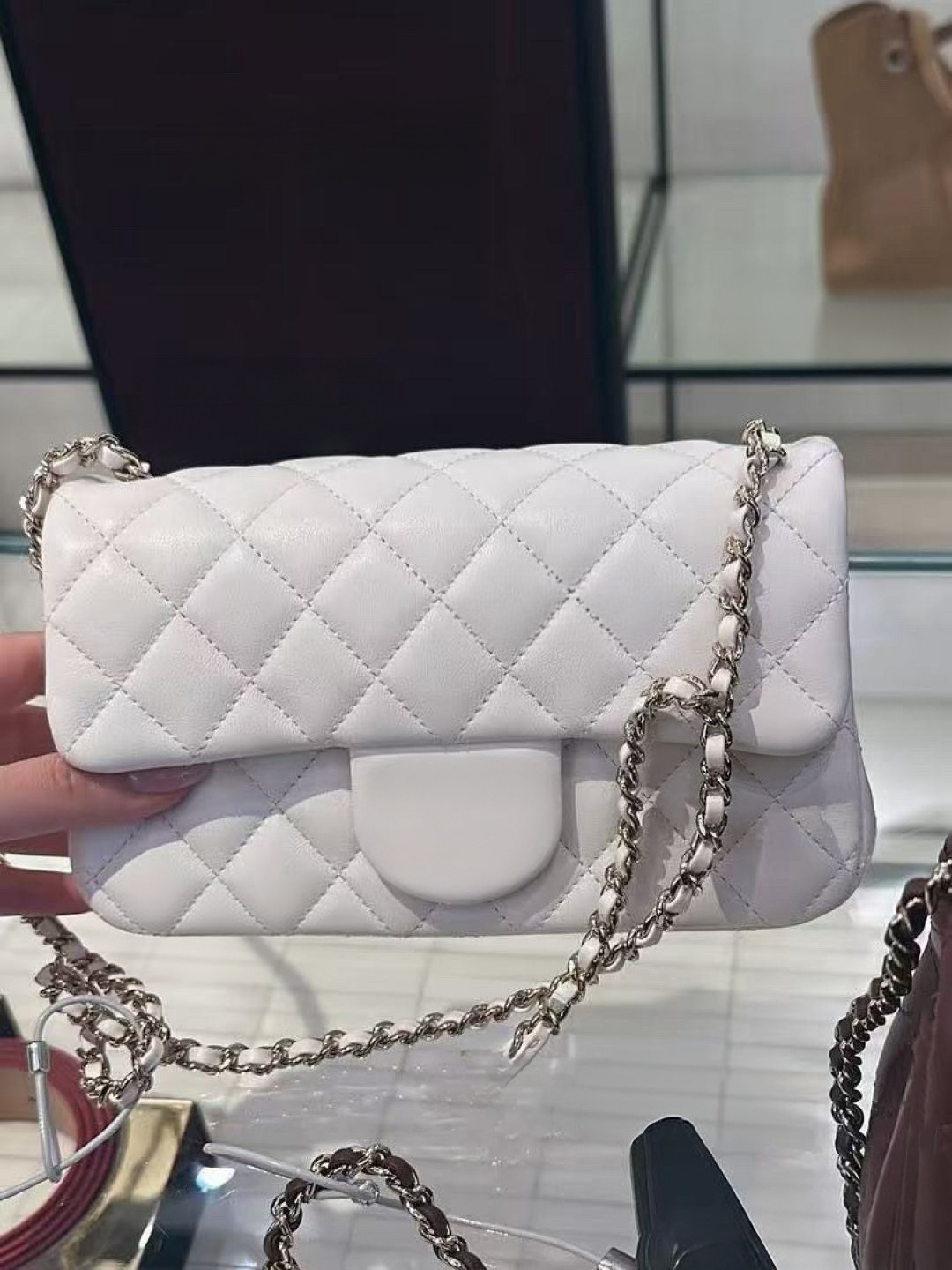 Top-quality 10A grade designer lambskin with amazing shine and texture, classic quilted chain detail paired with a stylish metal handle, comes with