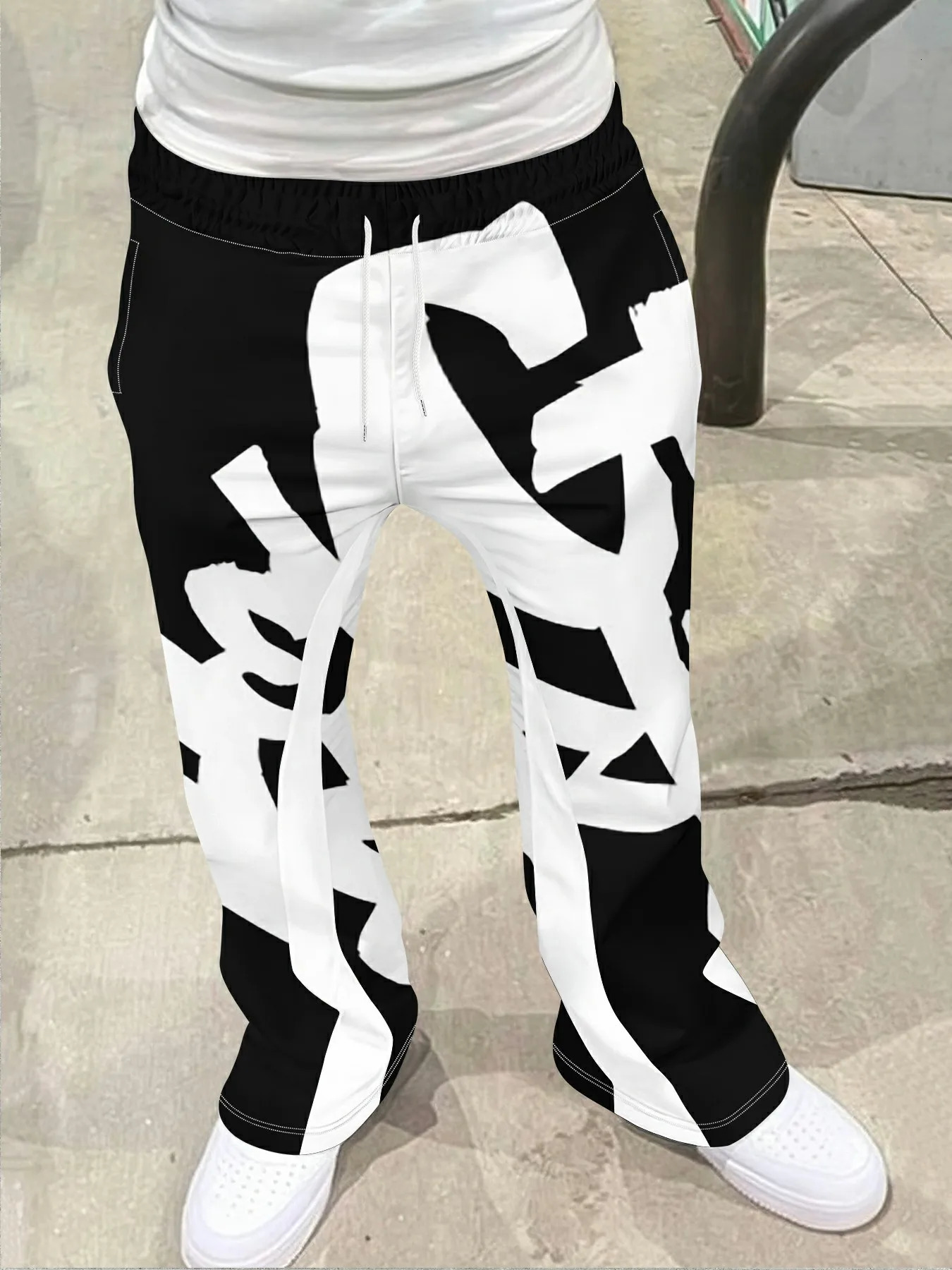 Hommes décontracté Style de rue à la mode imprimé croisé à la mode légèrement évasé noir et blanc couleur bloc pantalons de survêtement hommes pa