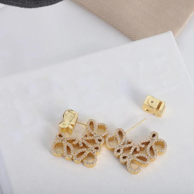 Boucles d'oreilles de luxe en or de luxe, élégantes boucles d'oreilles de créateur plaquées or 18 carats pour femmes, parfaites pour les fêtes de