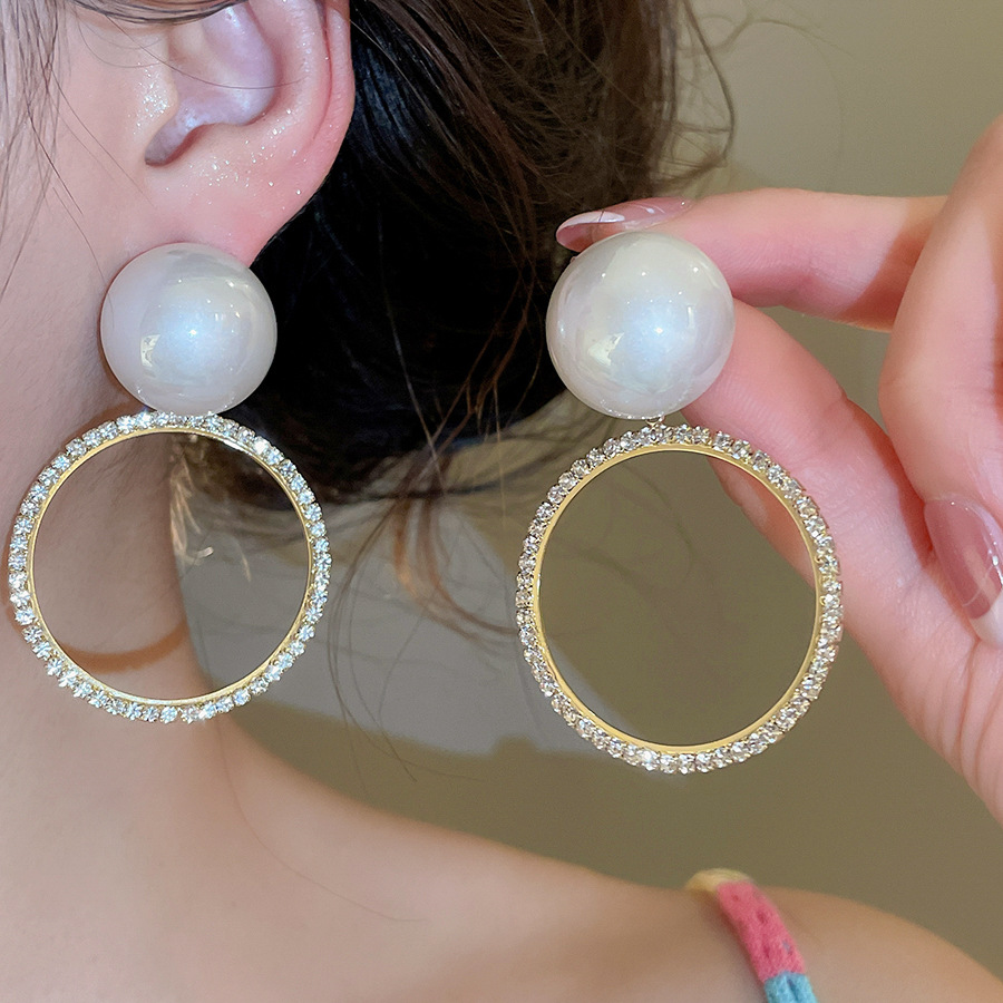 Silver needle with diamonds hollow circular pearl design, French vintage light luxury style, unique and stylish earrings for women-image-1098647316