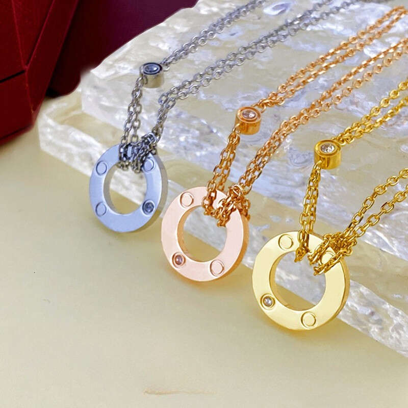 Collier Collier en or de luxe double anneaux collier d'amour bracelets de couple à la mode en acier titane incrusté de diamants chaînes doubles c