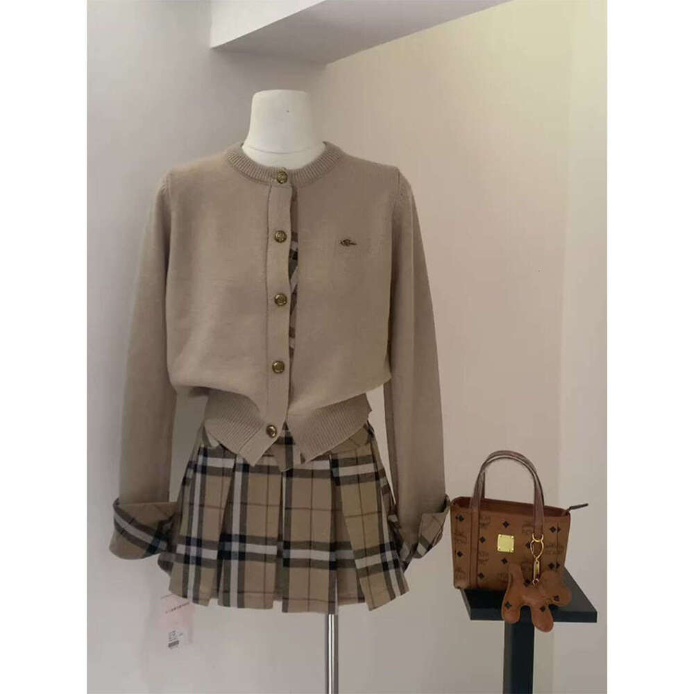 Korean Style Niche Design Round Neck Long Sleeve Plaid Knit Cardigan Top For Women New Autumn And Winter Pleated Short Skirt Set Luxury