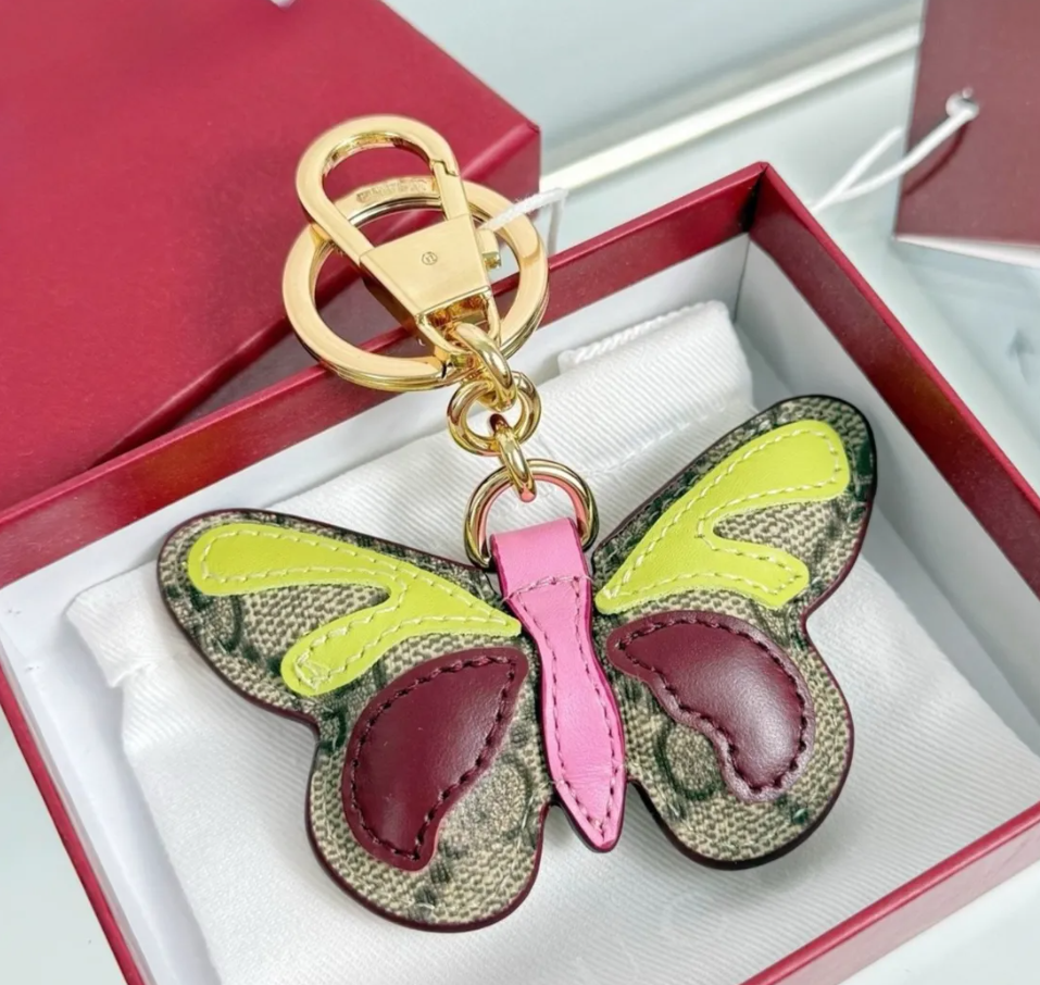 Porte-clés de créateur de mode unisexe, breloque de sac, classique en cuir, pour femmes et hommes, porte-clés de luxe
