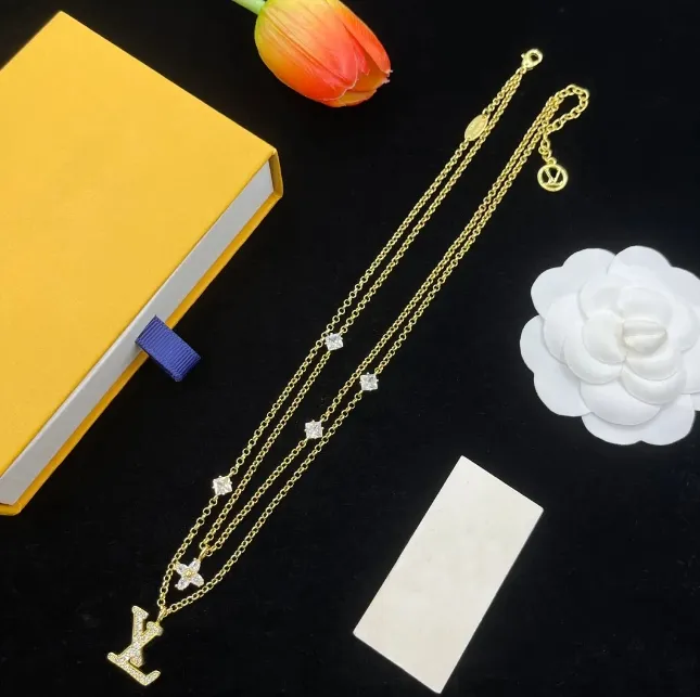 designer necklace pendant necklaces womens layered sweater chain 18k goldplated pendant necklace featuring a timeless diamond flower design-image-1104372034