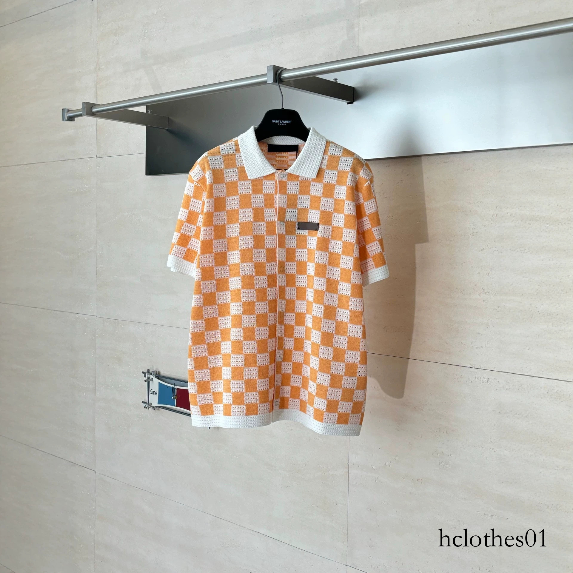 26SS luxury designer men's T-shirt from the trendy brand, Donkey Family, features a checkerboard color block and cut-out knitted PoLo collar sh
