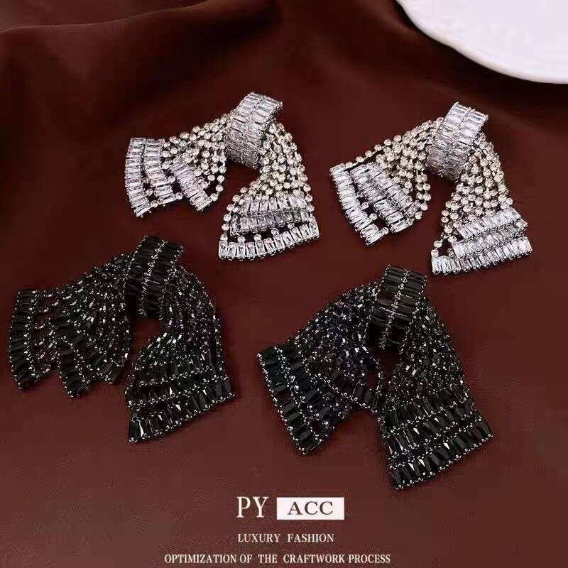 Tassel bow earrings with diamonds, high-end niche light luxury earrings, designer studs, European and American style
