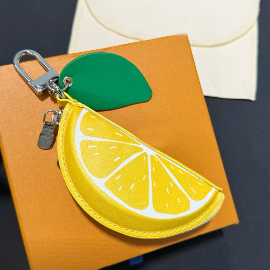 Designer Luxury Lemon Keychains Charm for Women Fruit LEMON Pouch Fashion Bag Pendant Mens Designers Leather Coin Purse Earphone storage bag Key Cha