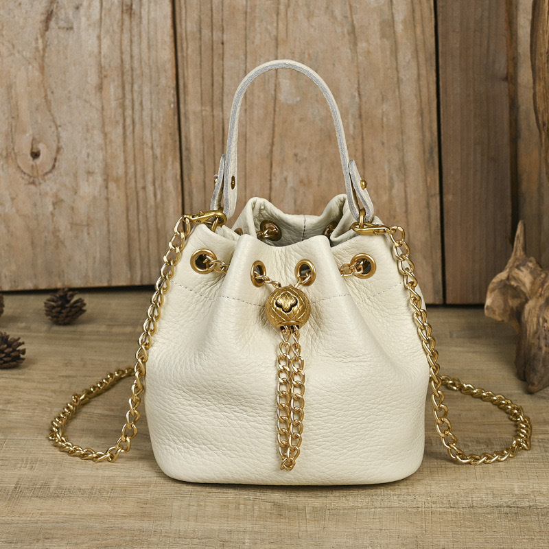 Free shipping 2026 new hot selling high quality soft cowhide women's bucket bag fashionable and versatile chain gold ball shoulder crossbody tr