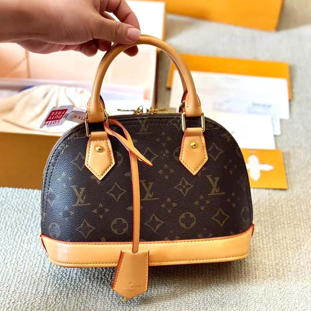 Sac de créateur sac à bandoulière de luxe Double fermeture à glissière pour femme Toile enduite avec garniture en peau de vache naturelle Sac à m