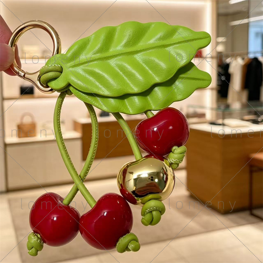 cherry charm in classic calfskin designer elf keychain wallet bag charms designer cherry key ring simple cute trendy bag charm ladies bag Decoration