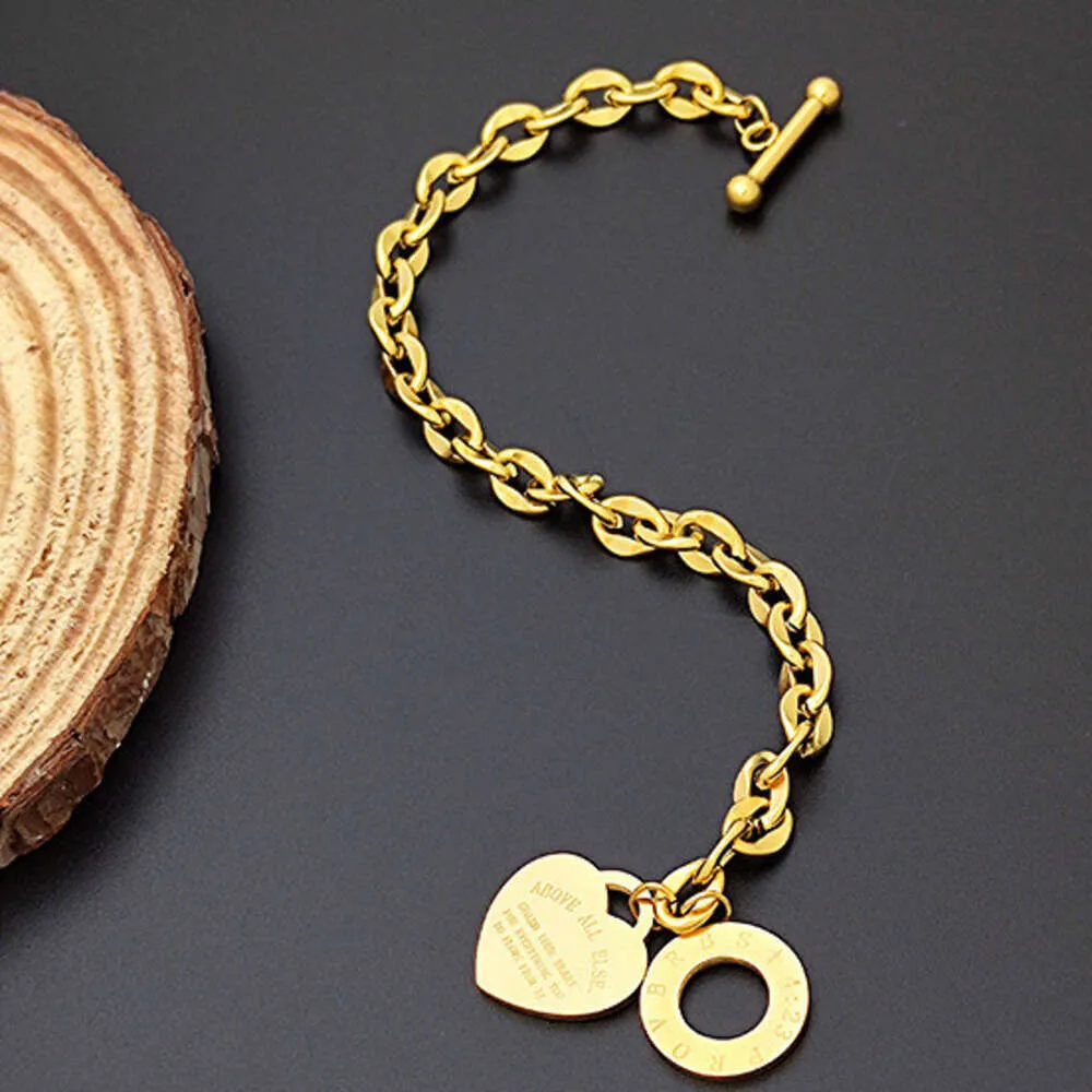 Elegant Golden Chain Bracelet Collection Featuring Heart Pendants & Adjustable Snap Fasteners-image-1108154423