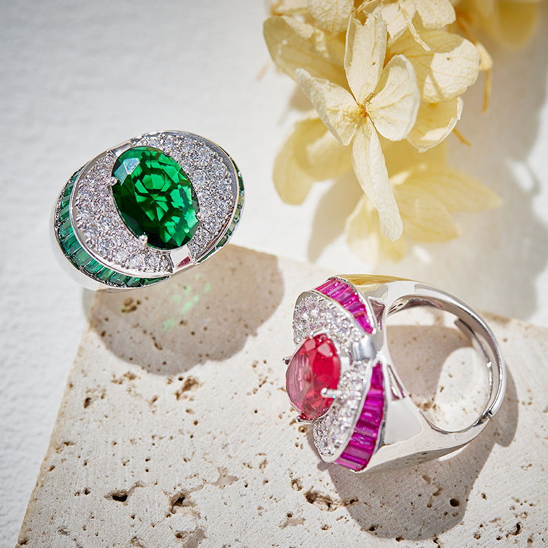 Fashion Statement: Shimmering Simulated Ruby Ring Set Against a Sparkling Sea of Mermaids