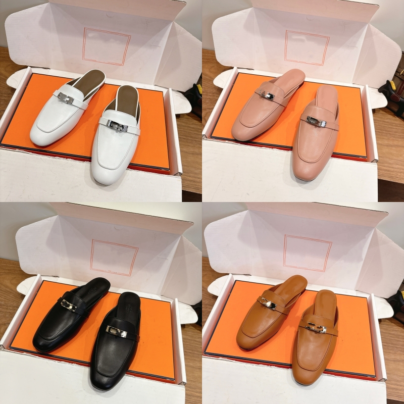 High-quality handcrafted smooth leather backless mules with metal buckle embellishments and a cushioned flat insole; perfect for everyday wear as