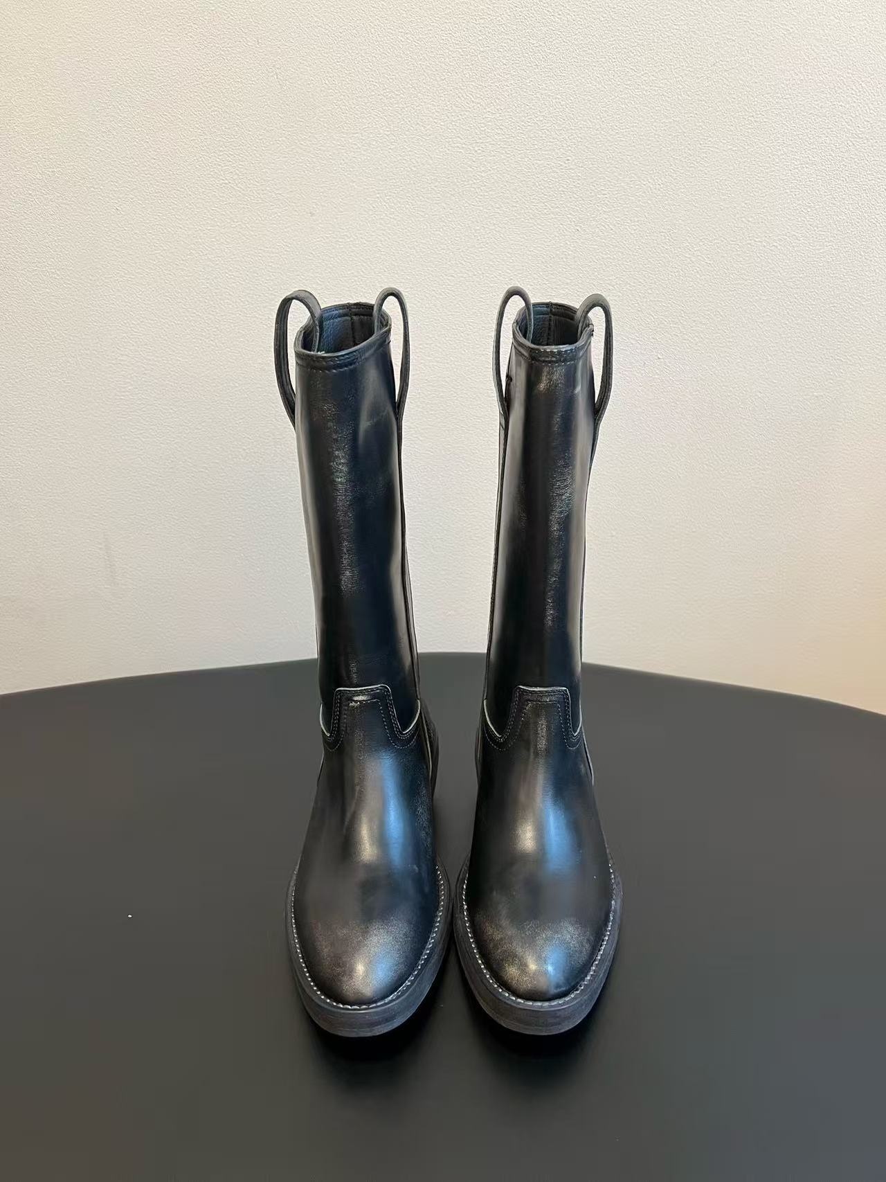 A new vintage distressed western cowboy mid-calf boots