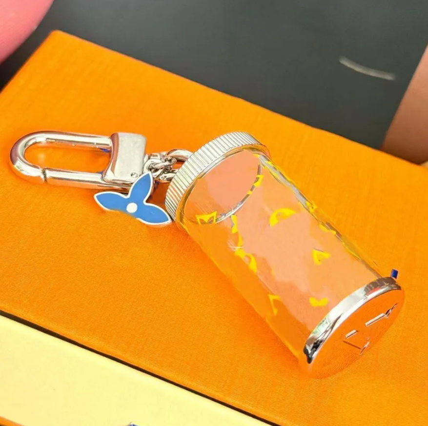 Porte-clés de bouteille de dérive imprimés classiques Lettre de créateur élégante pour femmes Charme Bouteille transparente Porte-clés Sac Charms