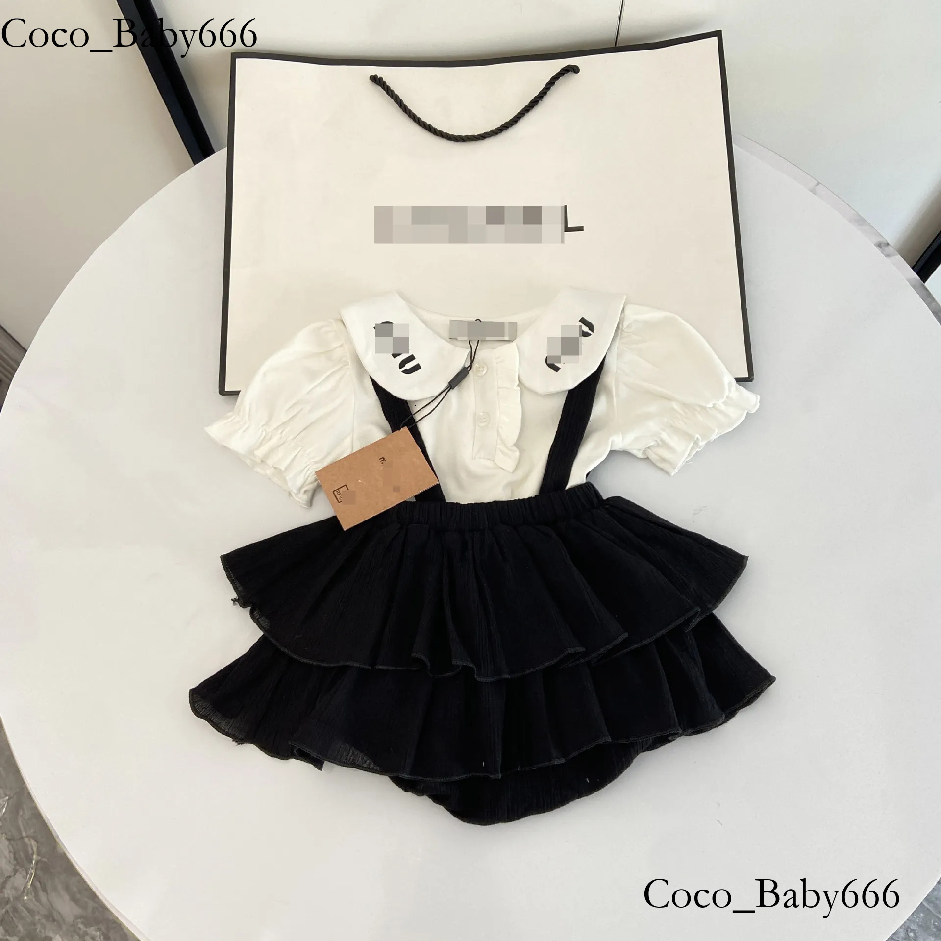 New hot selling designer clothes summer Korean style baby girl solid color large lapel shirt suspender bag butt pants skirt two piece set