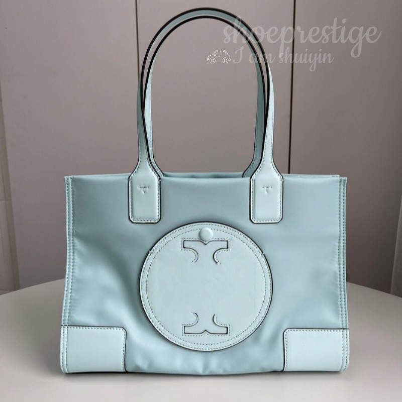 This is a high quality everyday handbag designed by a seasoned designer It is made of lightweight waterproof nylon fabric and adorned with exquisite