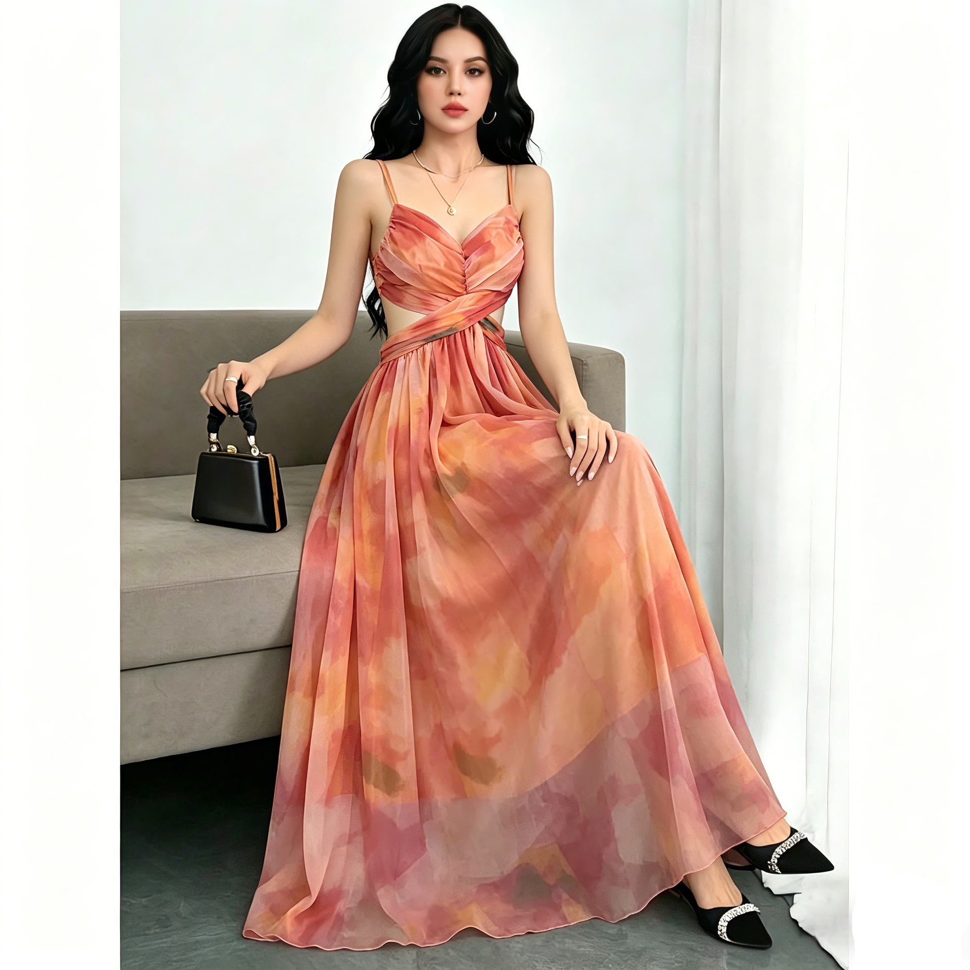 Une superbe robe d'été à imprimé floral orange avec une ambiance de vacances à la plage, dégageant un charme féerique et séduisant avec sa jupe l