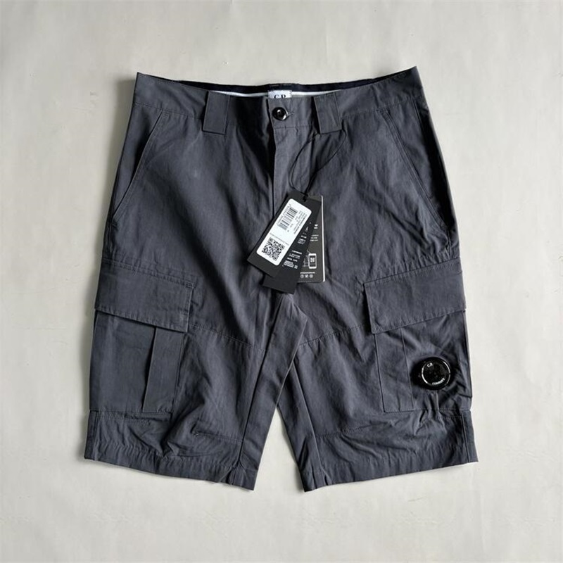 One lens short de travail populaire d'été, pantalon court de plage pour hommes en plein air avec badges mobiles