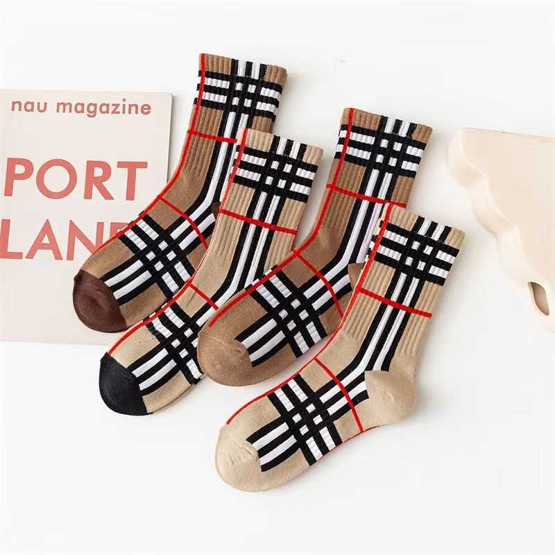 Autumn and winter trendy black and white checkered striped light-colored fashionable mid-calf socks popular online socks L260411