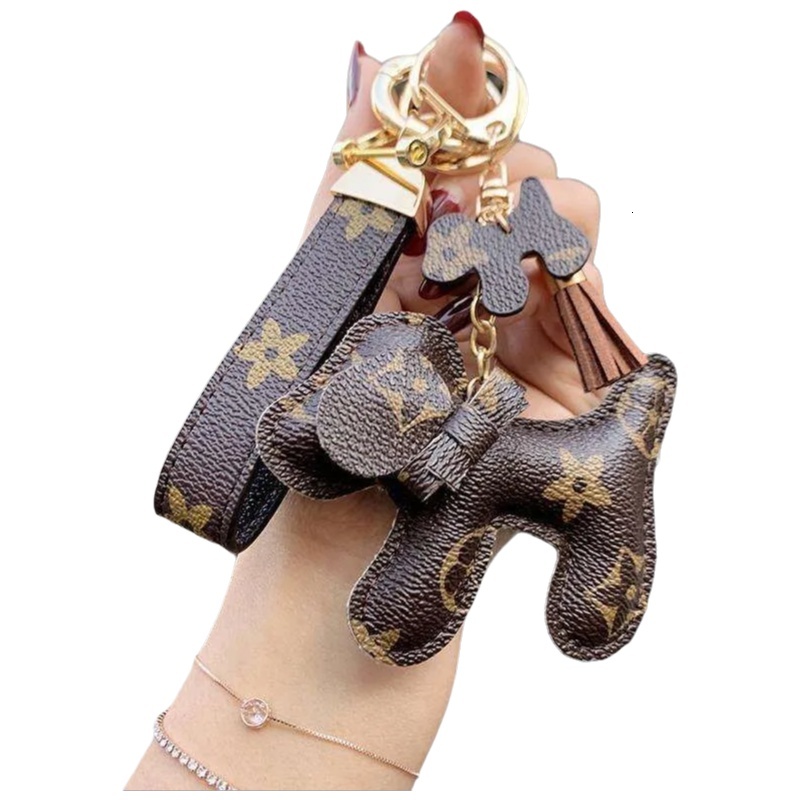 Porte-monnaie en forme de nœud papillon pour chien, porte-clés en peluche animale neutre avec bracelet en cuir et matériel en métal, pendentif de