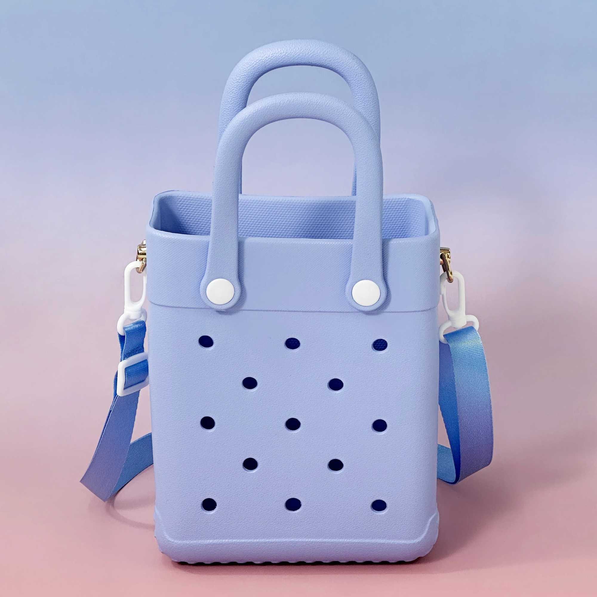 Ladys à la mode 21 cm X 16 cm X 75 cm sac à main en forme de trou pour le stockage des courses Mini sac pour femmes sac de plage EVA peut conteni