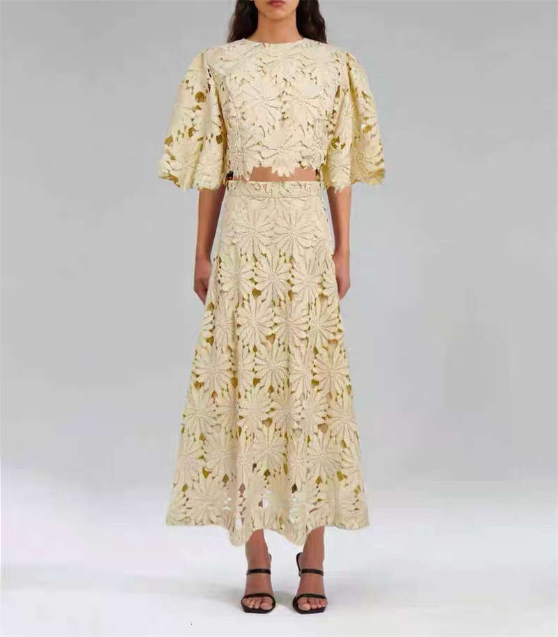 a15 Summer 2026 European and American women's niche daisy hollow lace bell sleeves short top big hem mid skirt vacation set