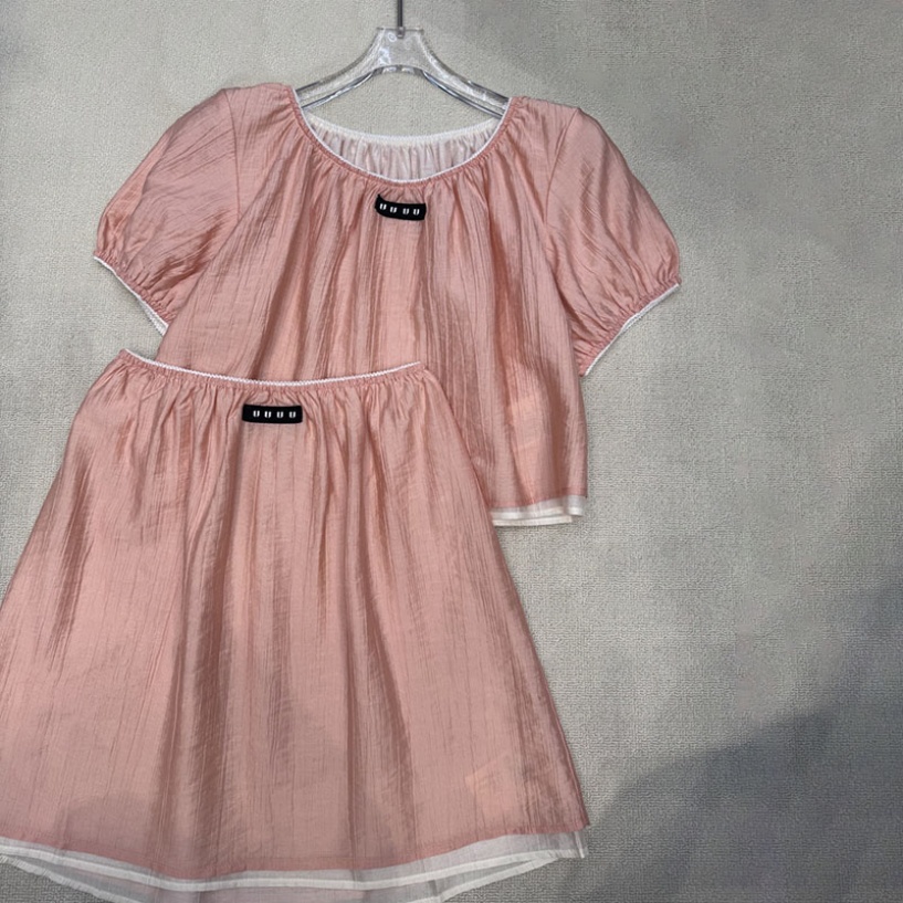 Faux 2 pièces t-shirts jupes plissées ensemble femmes élégant manches bouffantes t-shirts Style princesse luxe recadrée t-shirt Mini jupes costum