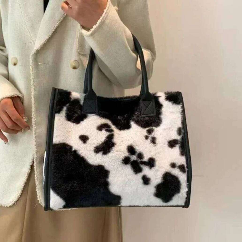 2026 New Women Soft Plush Hand New Winter Leopard Cow Print Tote Female Pu Leather Underarm Bags Furry Fluffy Shoulder Bag 26M0112 32 Free Shipping