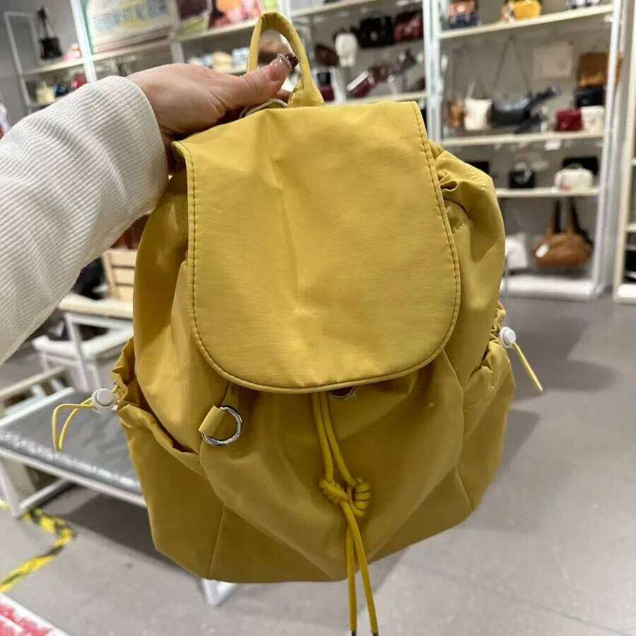2026 New Plaid Drawstring Large Capacity Student Lightweight Nylon Backpack, Fashionable Casual Women's Bag