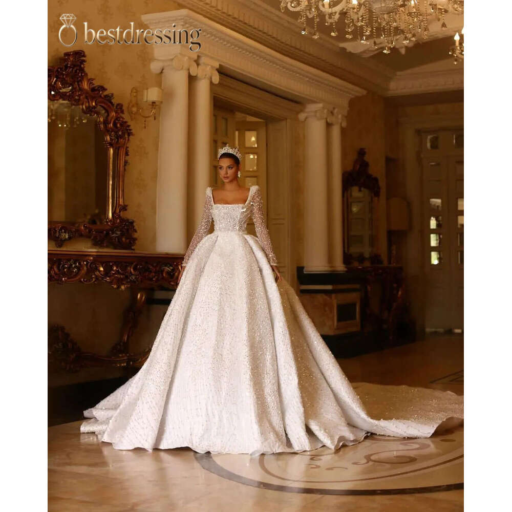 Stylish Ball Gown Wedding Dresses Bateau Long Sleeves Sequins Appliques Beaded Floor Length Ruffles 3D Lace Diamodns Pearls Bridal Gowns Plus Size V