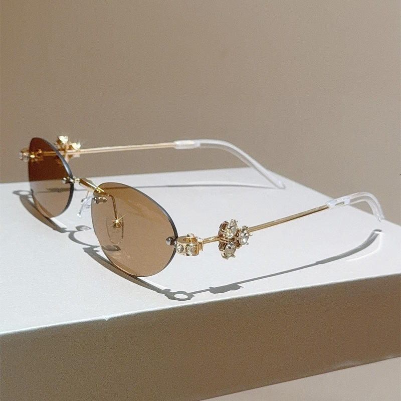 High quality Fashionable new diamond-embellished oval frame women's high-end rimless sunglasses, trendy street style glasses for stylish girls