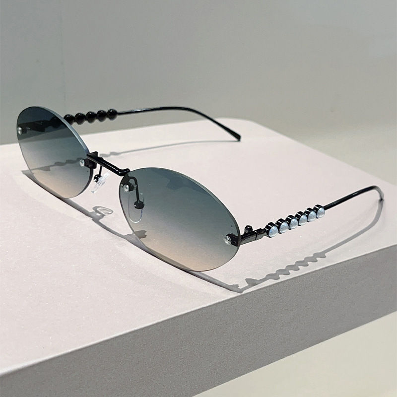 High quality 2026 New Fashion Light Luxury Oval Frameless Trendy Casual Travel Street Style Pearl Decorated Sunglasses