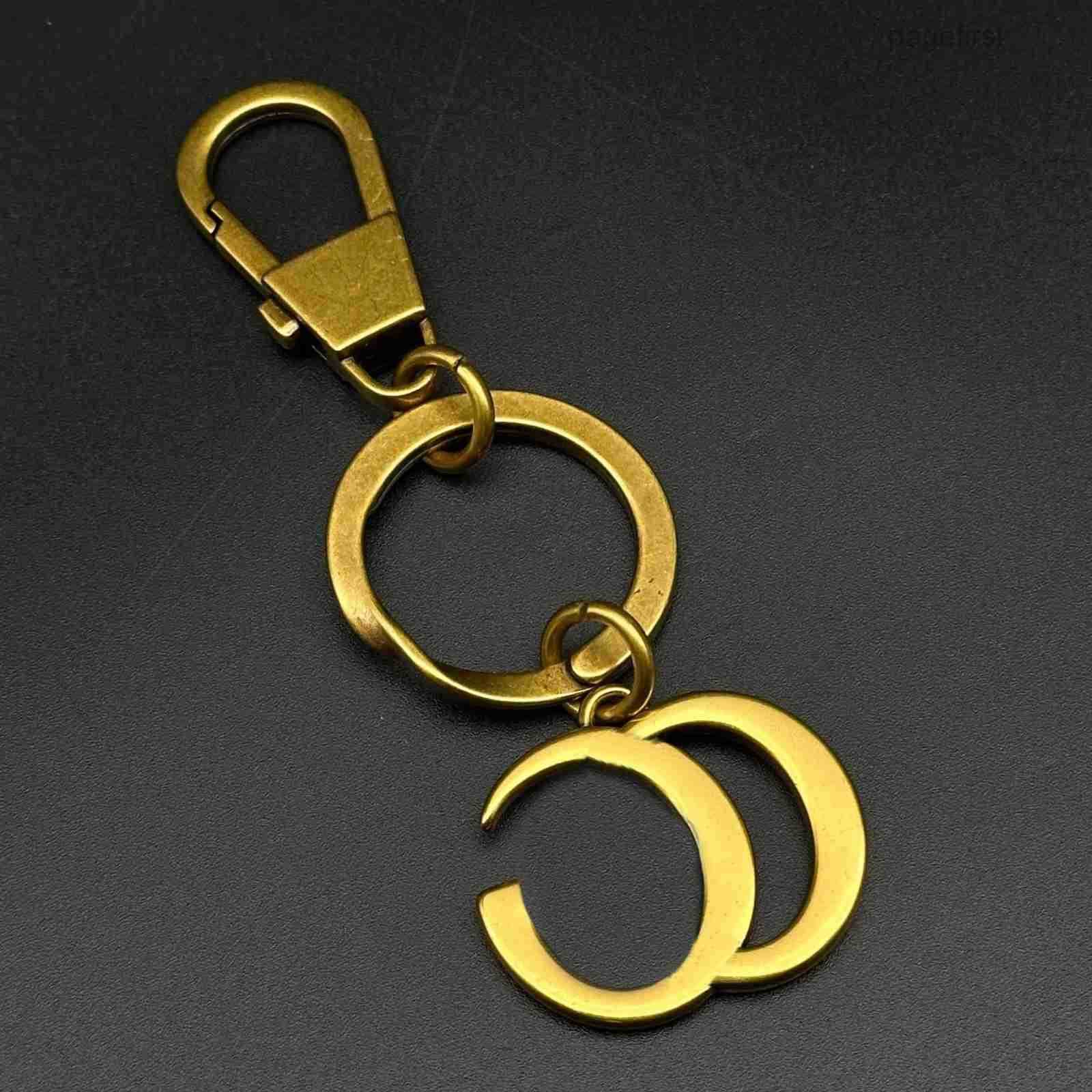Designer Antique Brass Tone Metal Keychain With Interlocking Crescent Shapes Vintage Elegant Daily Accessory Gifts For Her