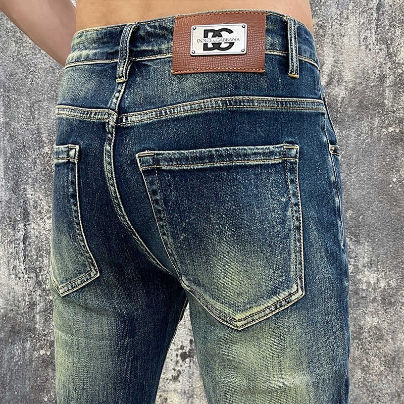 Guangzhou Xintang jeans mens cotton elastic Korean version small foot slim fit high-end European quality mens autumn pants L26624