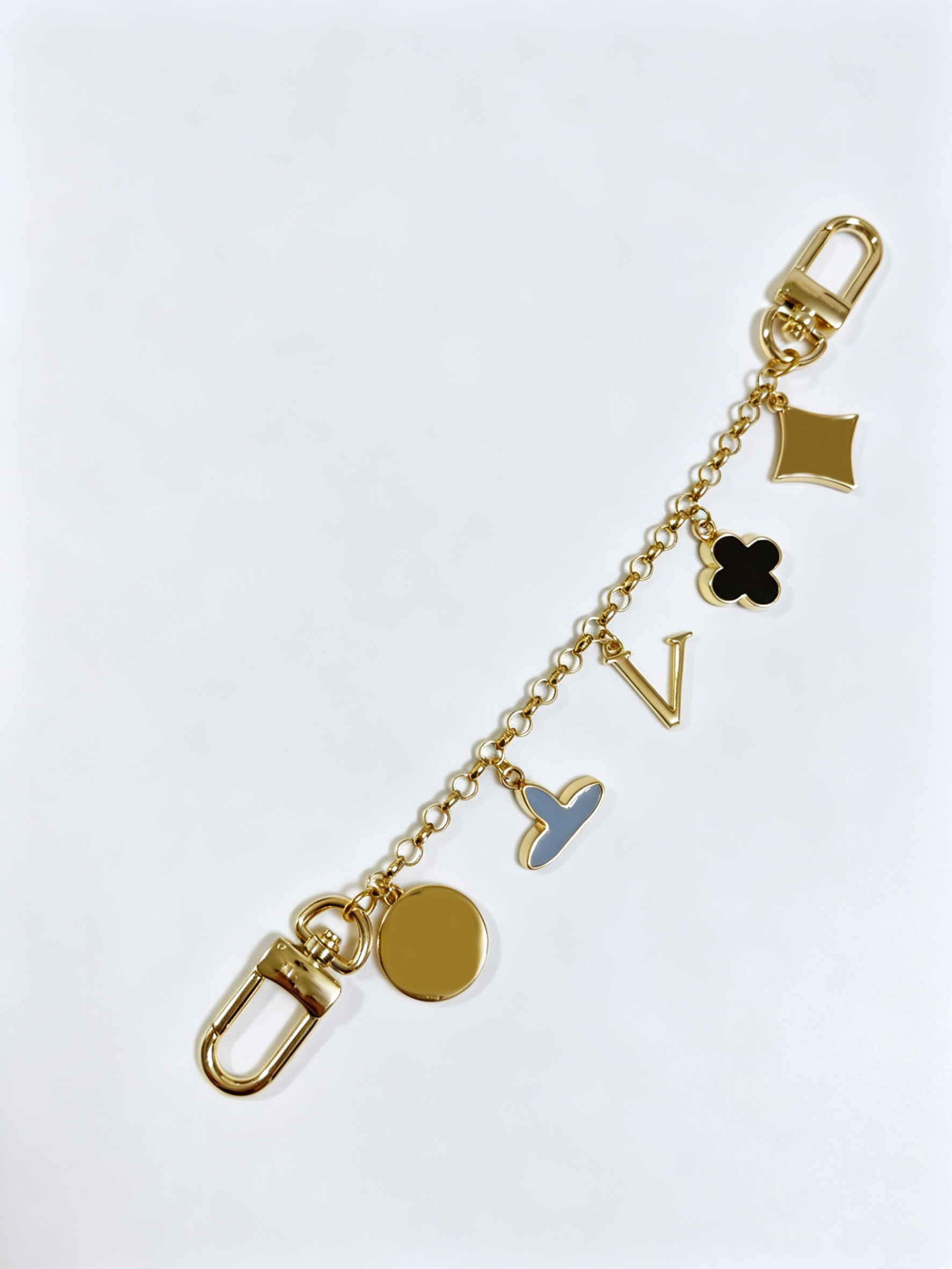 2026 New Gold Plated Metal Keychain Multi Pattern Clover Heart Letter Handbag Charms Anti-lost Spring Hook Key Ring for Daily Travel Gift for Ladies