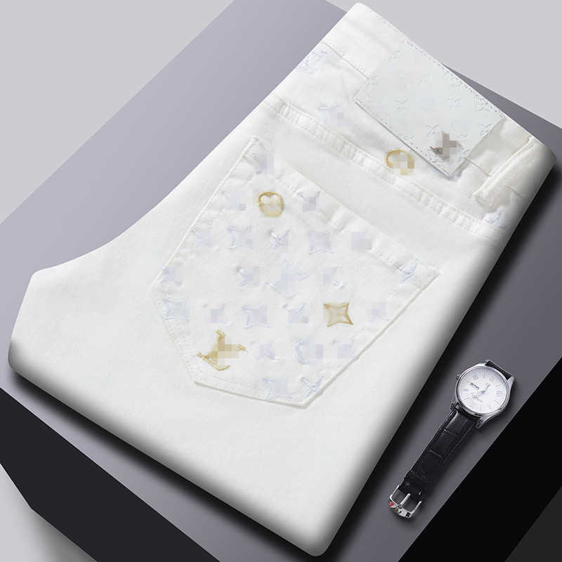Spring new jeans mens trend slim fit small feet elastic casual white 11 washed embroidered European goods L26624