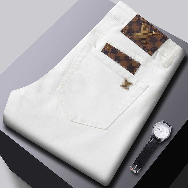 Spring new jeans mens trend slim fit small feet elastic casual black and white long pants 11 high-end European goods L26624