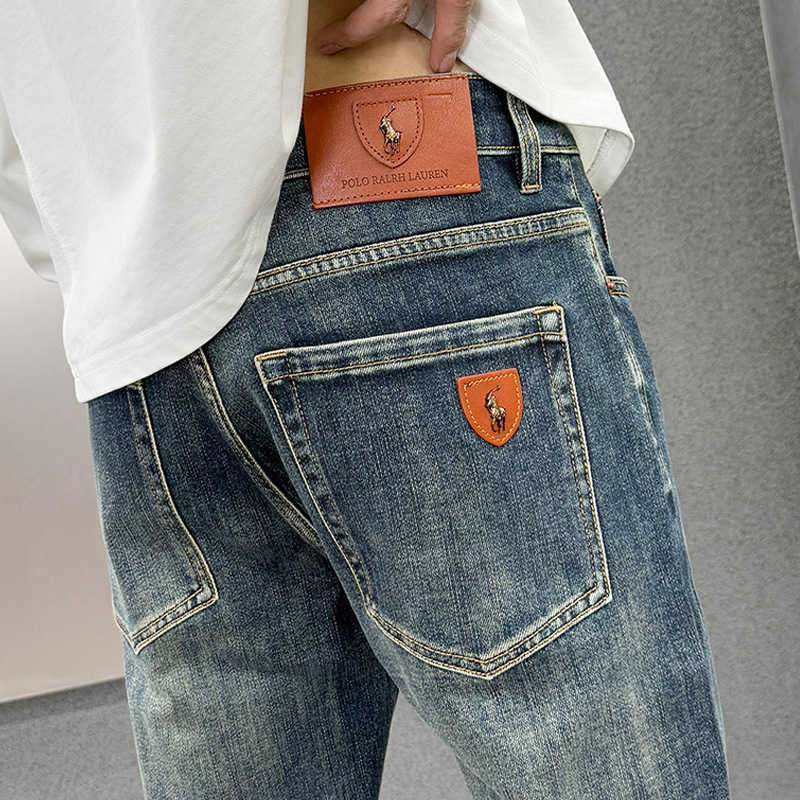 Guangzhou Xintang mens jeans Korean style stretchy high-end European goods slim-fit polo pants for young students L26624