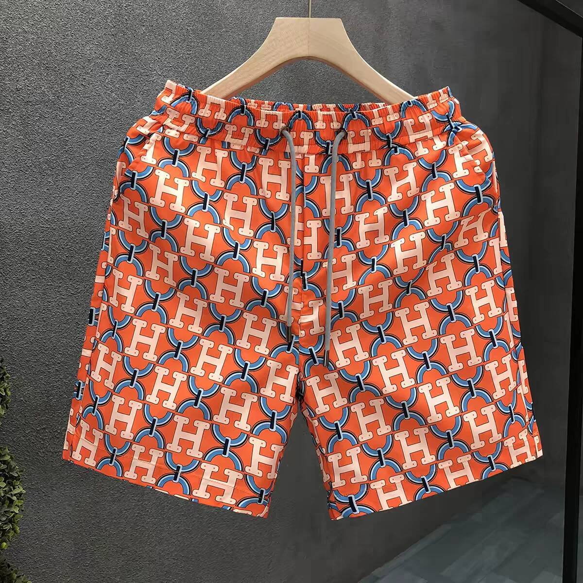 Strandshorts voor heren, oranje polyester sneldrogende boardshorts met volledige H-letter dierenprint, knielange casual zwembroek, platte voorkant,